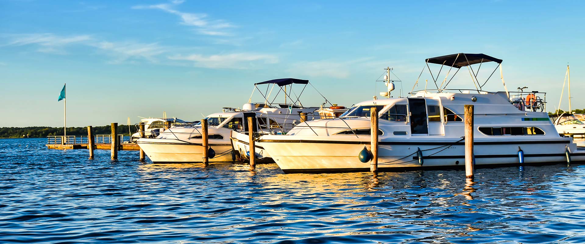 Houseboats moored at jetty.